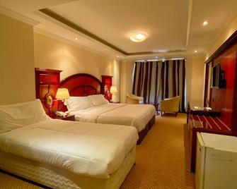 New Penninsula Hotel - Dubái - Habitación