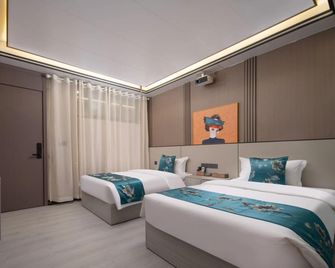 Danheya Audio-Visual Hotel (Yibin Hejiang Branch) - Yibin - Bedroom