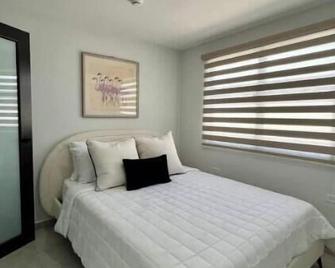 Casita Antonia: Orquídeas - Aguadilla - Schlafzimmer