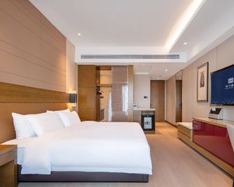 Yangzhou Hengli Select Hotel - Yangzhou - Schlafzimmer