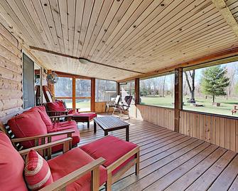 Northwoods Getaway- Private Swimming Pond, hot Tub, & 70 Acres of Woods - New Lisbon - Patio