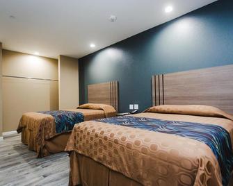 Budget Host Inn & Suites - Sugar Land - Slaapkamer