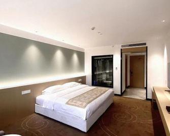 Fusheng Hotel - Qingdao - Habitación