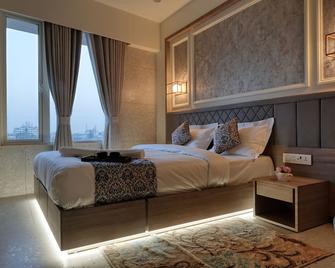 Hotel Elysian Residency - Ахмедабад - Спальня