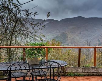 Jacuzzi in bedroom with mountain views, barbecue and fireplace - San Martín de Teverga - Balcón