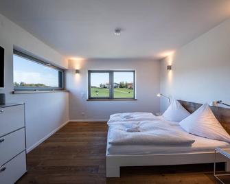 Luxurious design holiday home with mountain view, fireplace and garden - Breitbrunn am Chiemsee - Bedroom