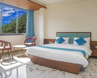 Hotel Yashoda - Uruli Kānchān - Bedroom