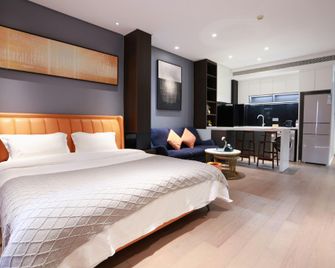 E953 Wushe Homestay (Peony Plaza Wanda Plaza Branch) - Luoyang - Camera da letto