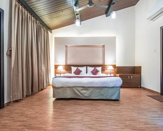 Treebo Five Elements, Lonavala - לונאבאלה - חדר שינה