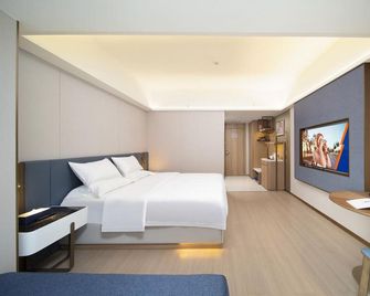 Created Ashton Business Hotel - Wuzhou - Bedroom