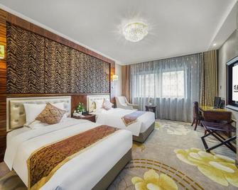 شيان شينغ زين غيوان هوتل - زيان - غرفة نوم