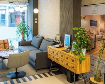 Bilbao City Center by abba Suites - Bilbao - Living room