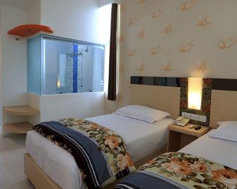 Hotel Dewarna Sutoyo Malang - מאלאנג - חדר שינה
