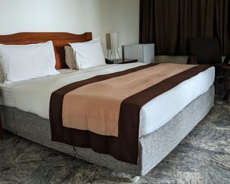 فيرونيكا جيست هاوس - لومي - غرفة نوم