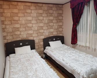 إيه جي هوستل - جيجو - غرفة نوم