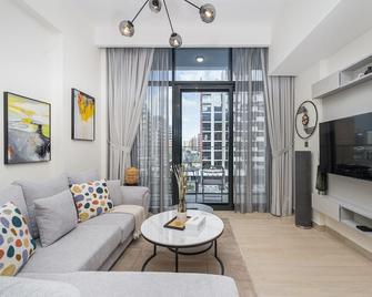 Comfy 1BR in Azizi Riviera 8, Al Merkadh by Deluxe Holiday Homes - Dubai - Living room