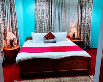 Aman Palace Hotel - Srinagar - Slaapkamer