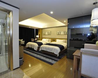 Mingchun International Hotel - Kunming - Bedroom