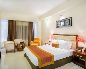 Grand Harmony Beach Resort - Kovalam - Bedroom