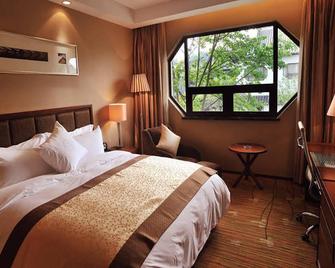 Yangzhou Hentique Huijin Resort Hotel - Yangzhou - Habitación