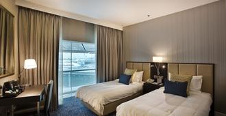 โรงแรมแอมบาสเดอร์ ทรานซิต เทอร์มินอล 3 - สิงคโปร์ - ห้องนอน