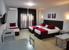 Apartamentos Puerta del Sur - Sevilla - Schlafzimmer