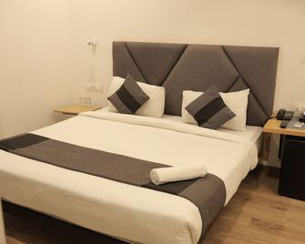 Signature Inn - Nagpur - Schlafzimmer