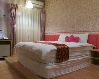 Quan Fu Tan Hui Hotel - Yuchi Township - Schlafzimmer
