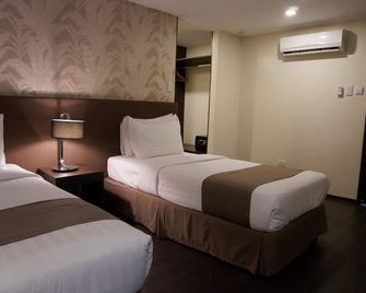 جي تي هوتل إيلويلو - إيلويلو ستي - غرفة نوم