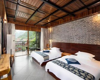 Impression Xijiang Resort hotel - Qiandongnan - Bedroom