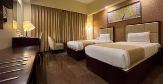 Hotel O2 Oxygen - Calcutta - Slaapkamer