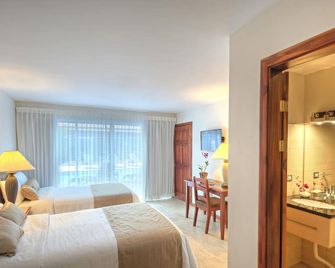 هوتل ترامونتو - جاكو - غرفة نوم