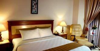 Grand Tiga Mustika Hotel - Balikpapan - Bedroom