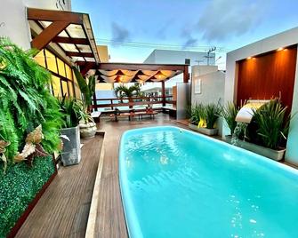 Pousada Encantare - אראקאז'ו - בריכה