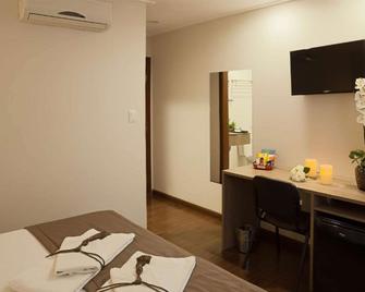 TRYP by Wyndham Varginha Cafe Royal - Varginha - Schlafzimmer