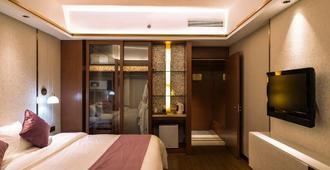 Wenzhou Yaoxi Dynasty Hotel - ونزهو - غرفة نوم