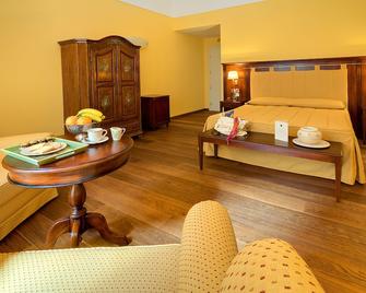 Hotel La Plumeria - צ'פאלו - חדר שינה