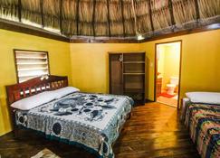 Cabanas under the palms and on the river - just 3 mi from San Ignacio - Bullet Tree Falls - Bedroom