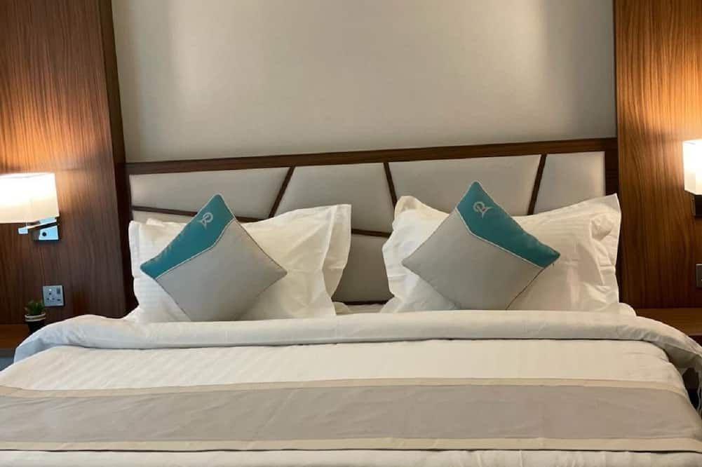 أجنحة ريماز الفندقية - الجبيل - غرفة نوم