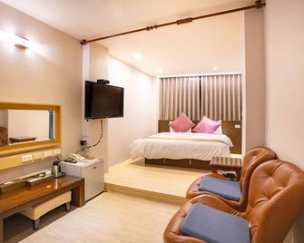 Mei Jia Mei Hotel - אילאן סיטי - חדר שינה