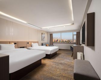 Rose Hotel - Zibo - Schlafzimmer