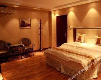 Yongcheng Business Hotel - Tonghua - Bedroom