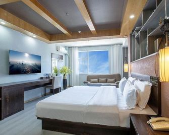 Badi E family chain Hotel - ליז'יאנג - חדר שינה