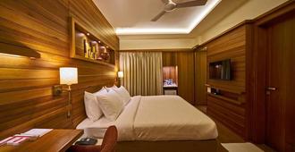 Hotel Atharv Top Rated Business Hotel in Kolhapur - Kolhāpur - Bedroom