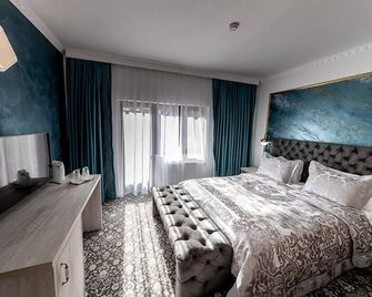 Suru Hotel & Restaurant - Busteni - Спальня