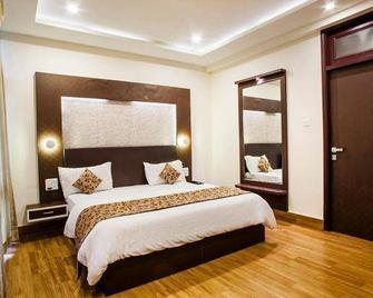 Hotel Celebration & Banquets - Kota - Habitación
