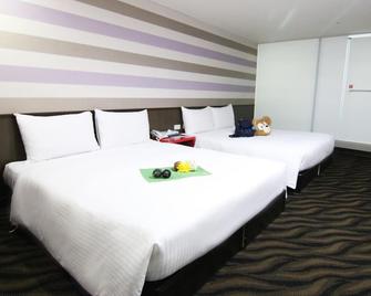 Liho Hotel Tainan - Tainan - Schlafzimmer