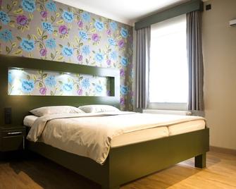 Belrom Hotel - Sint-Truiden - Schlafzimmer