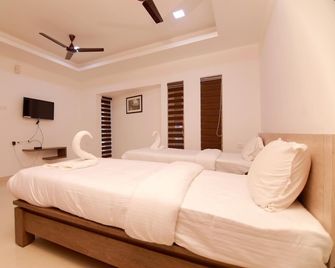 Chandra Inn - Kollam - Camera da letto