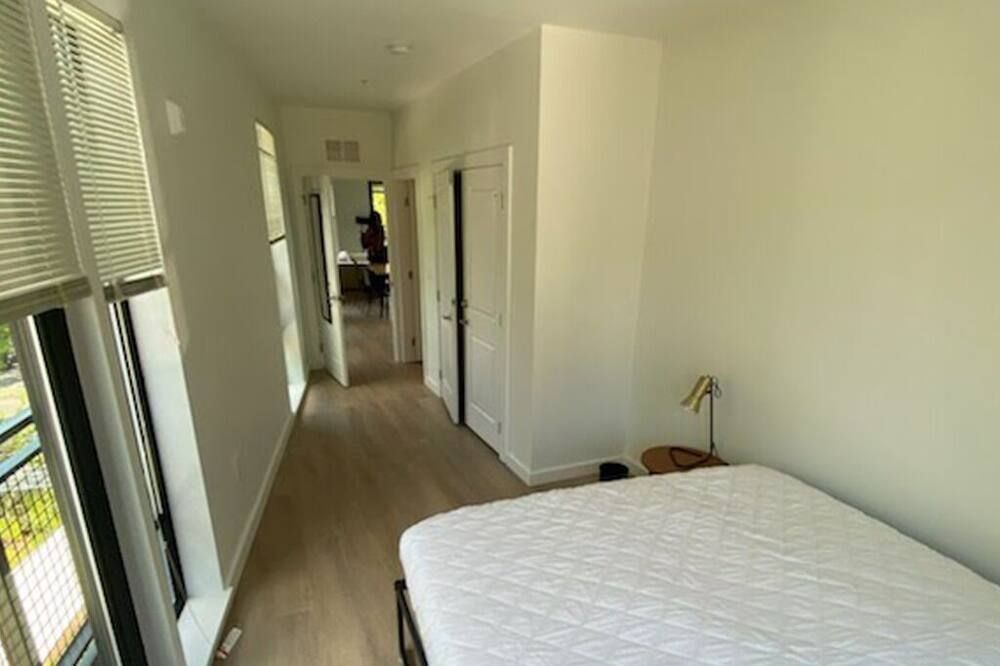 Bedroom view of Award Rentals in Washington DC. Multiple levels of amenities and shared space.